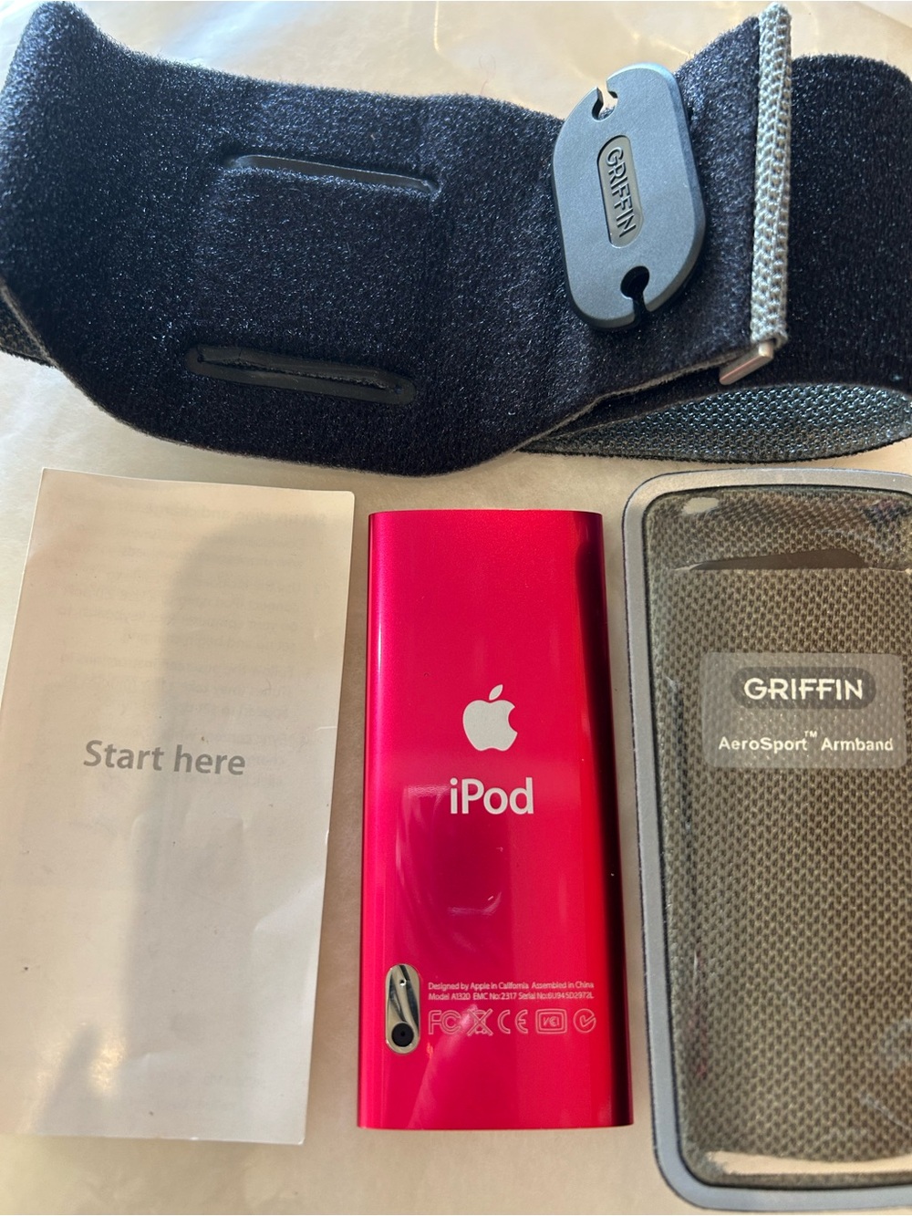 Apple iPod Nano in vibrant pink with Griffin armband and case